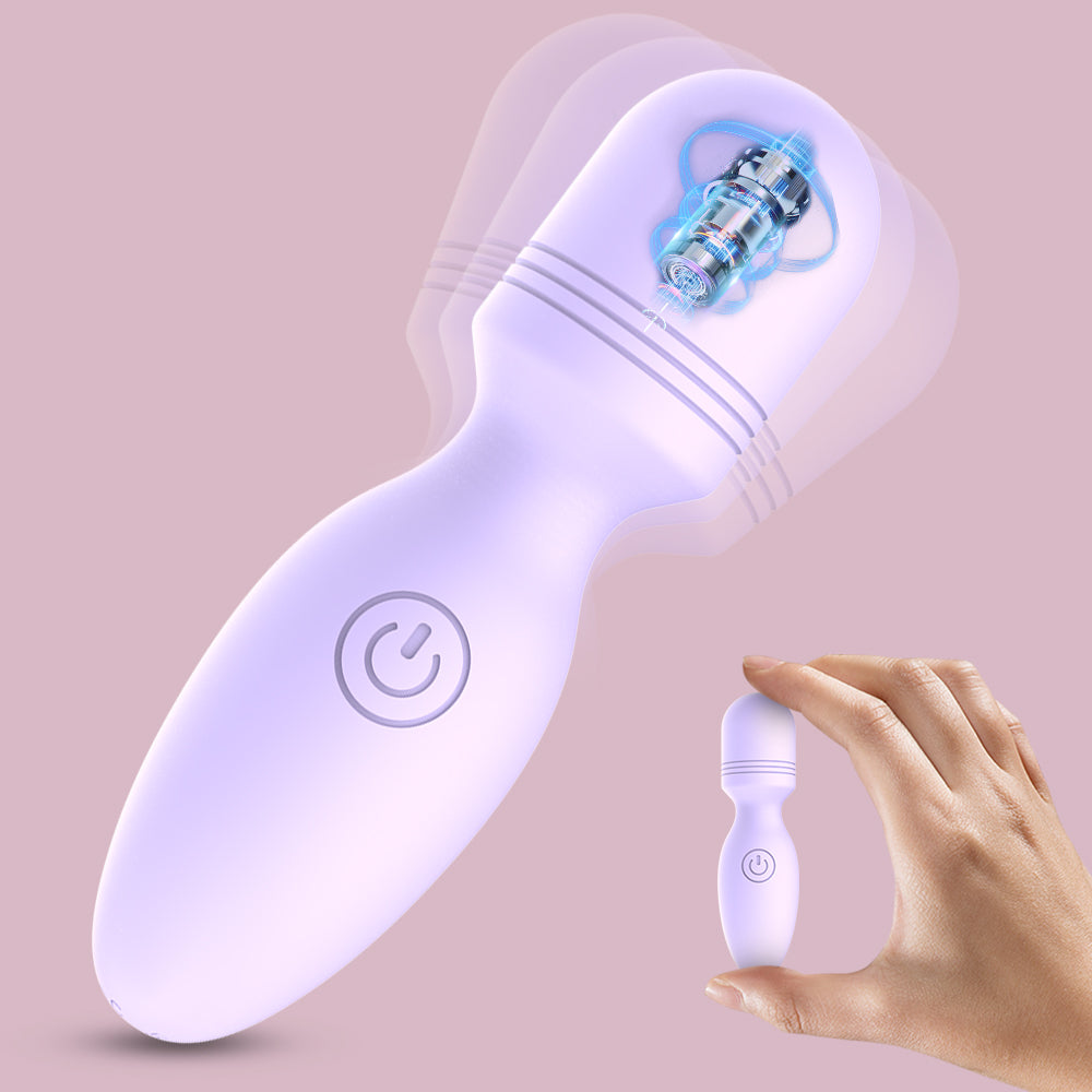 Lila Vibrator in Hand gehalten